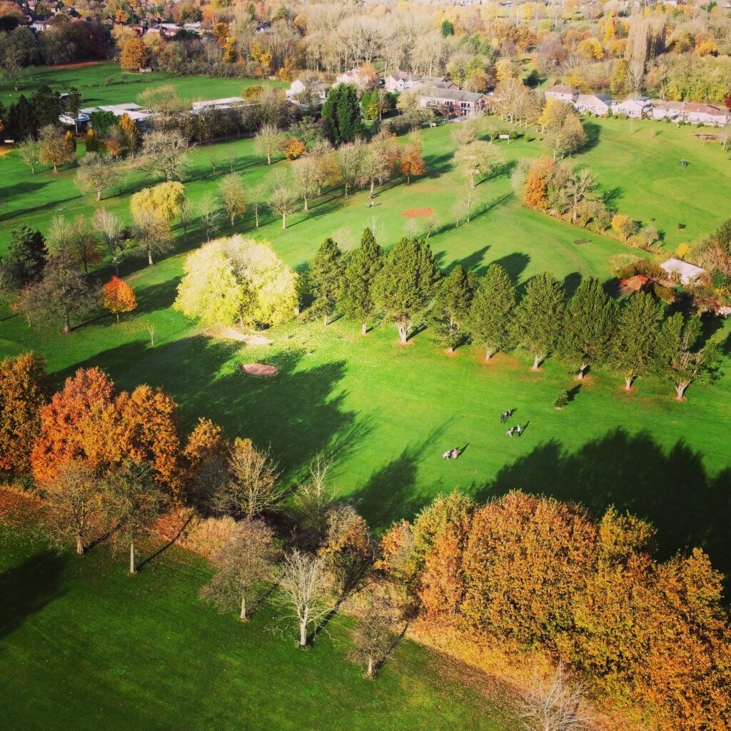 A view across the course from the 5th fairway to the Flixton Golf Course Clubhouse at the very top of the photo