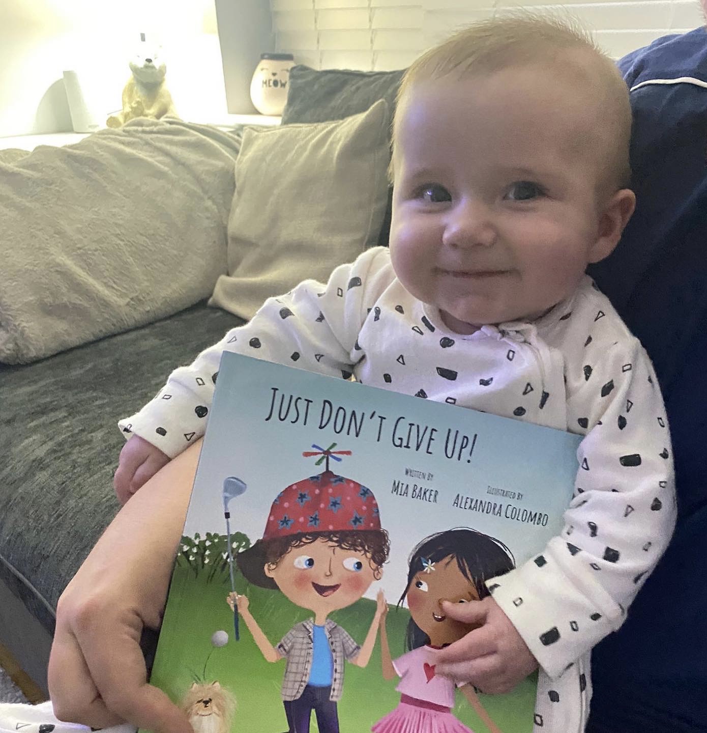 My Grandson with his first Golf Book - Just Don't Give Up by Mia Baker